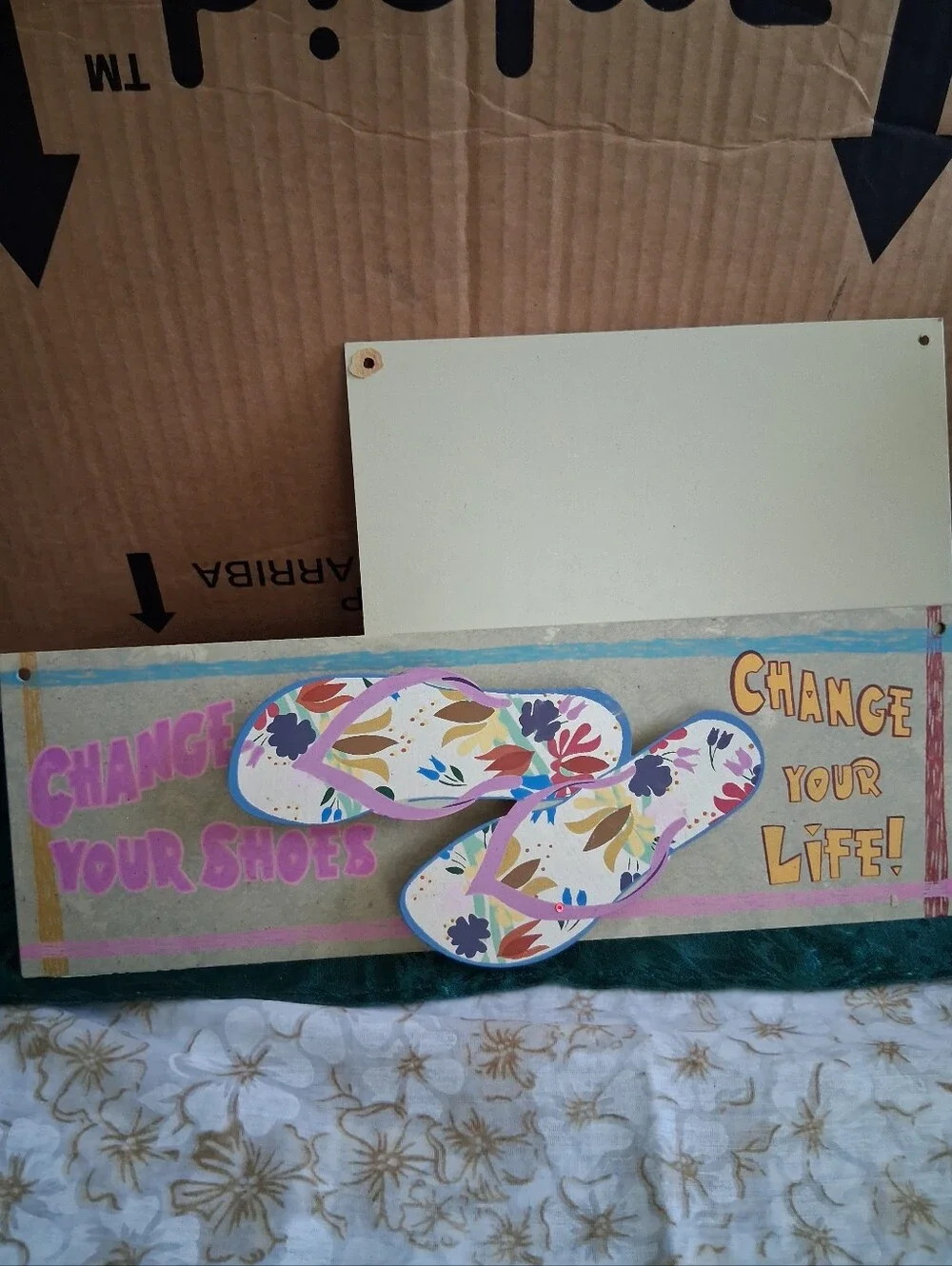 2 Beach Signs with Striped And Flowered Flip-Flops.